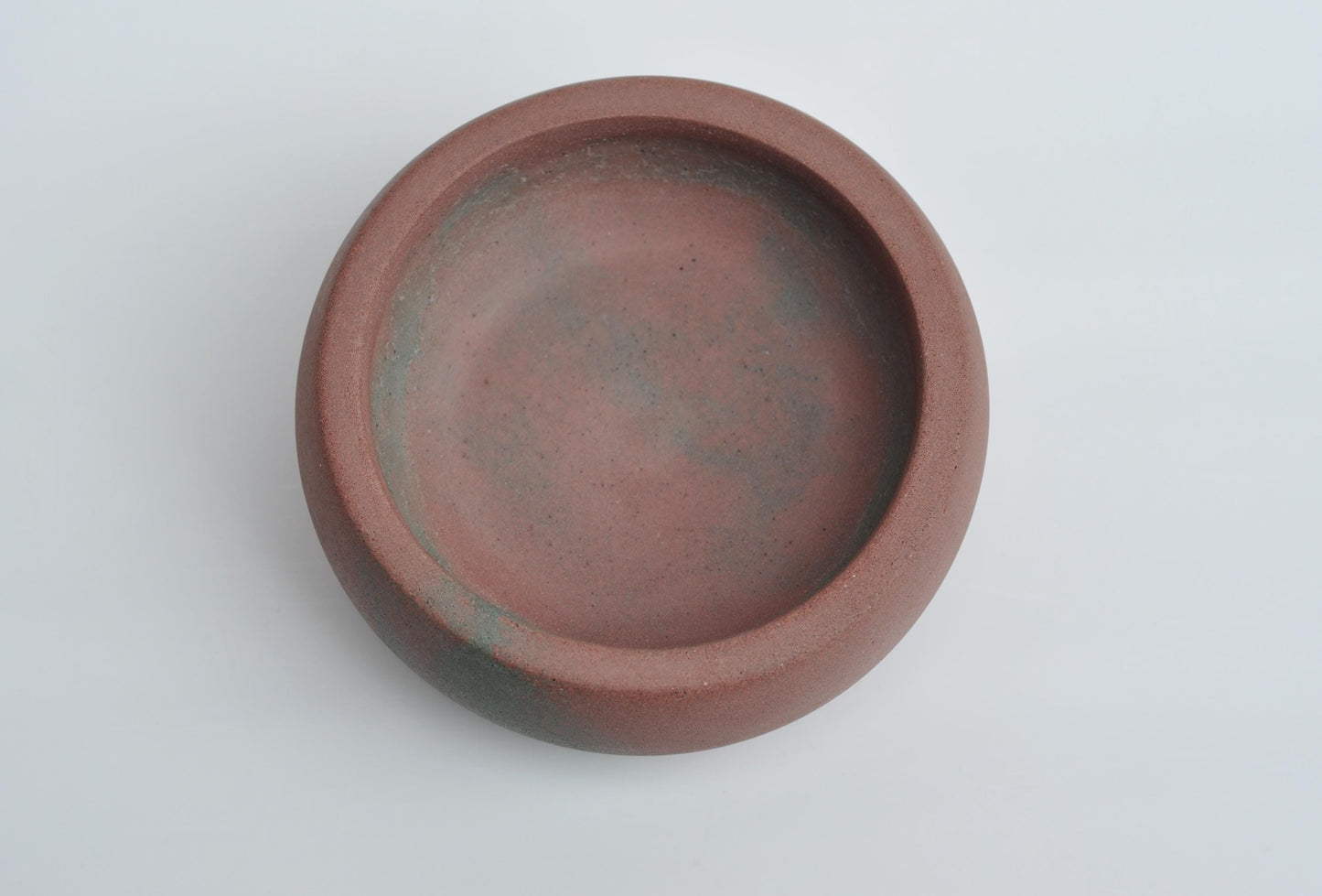 Decorative concrete trinket dish on desk