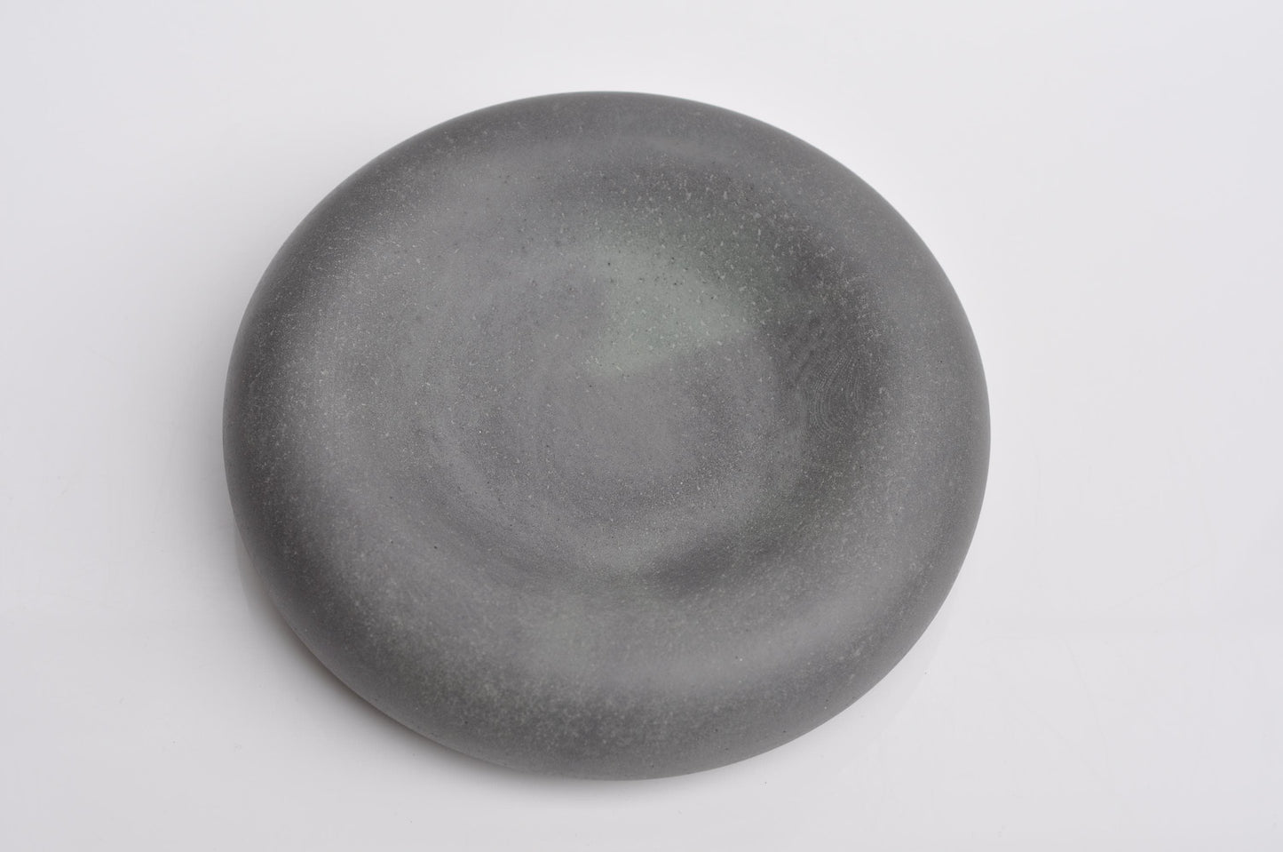 Studio shot of handmade minimalist concrete key bowl