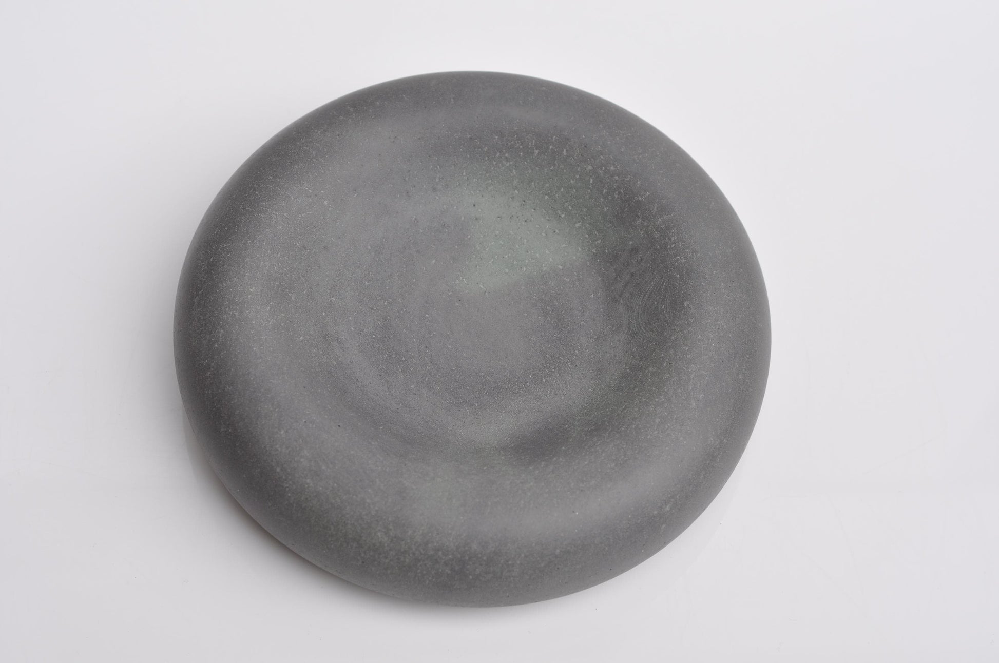 Studio shot of handmade minimalist concrete key bowl