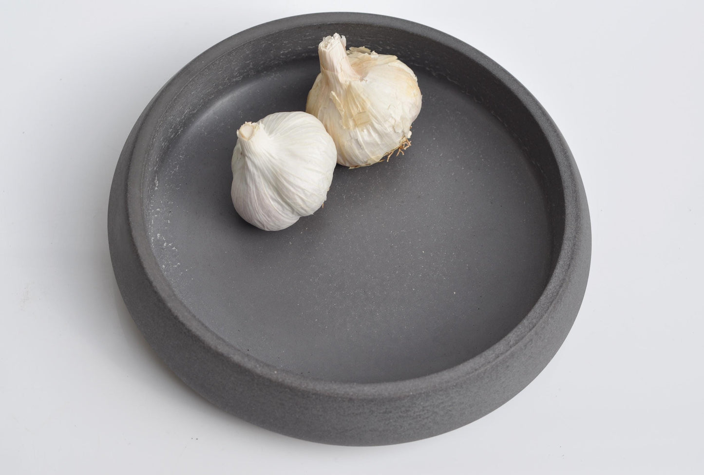 Studio shot of handmade anthracite concrete bowl