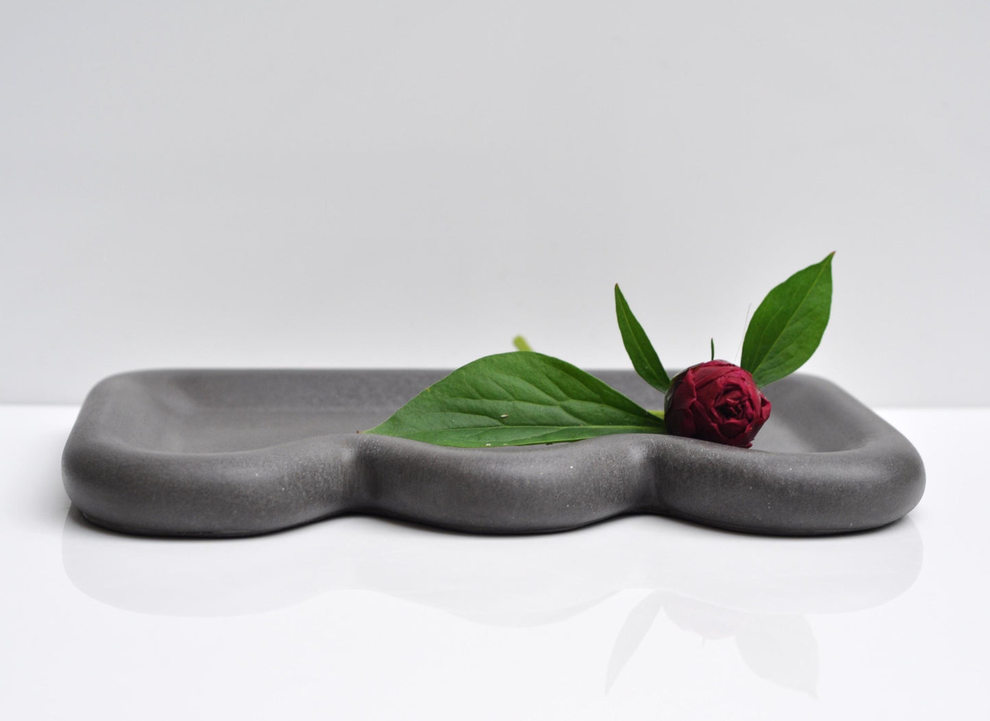 Studio shot of modern minimalist anthracite concrete tray