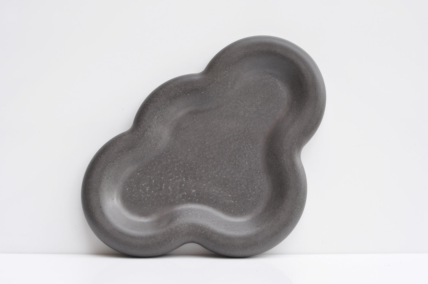 Modern concrete dish used as catchall for home