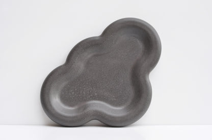 Modern concrete dish used as catchall for home