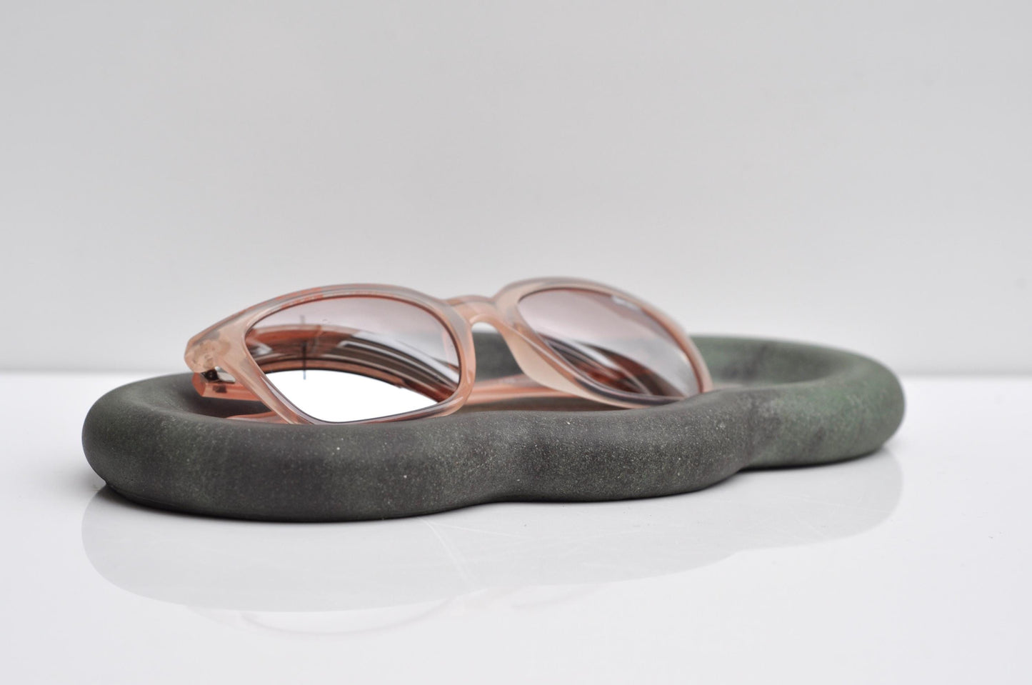 Studio shot of handmade anthracite and green concrete tray