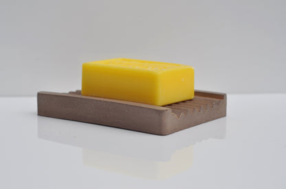 Brown cement soap tray on countertop