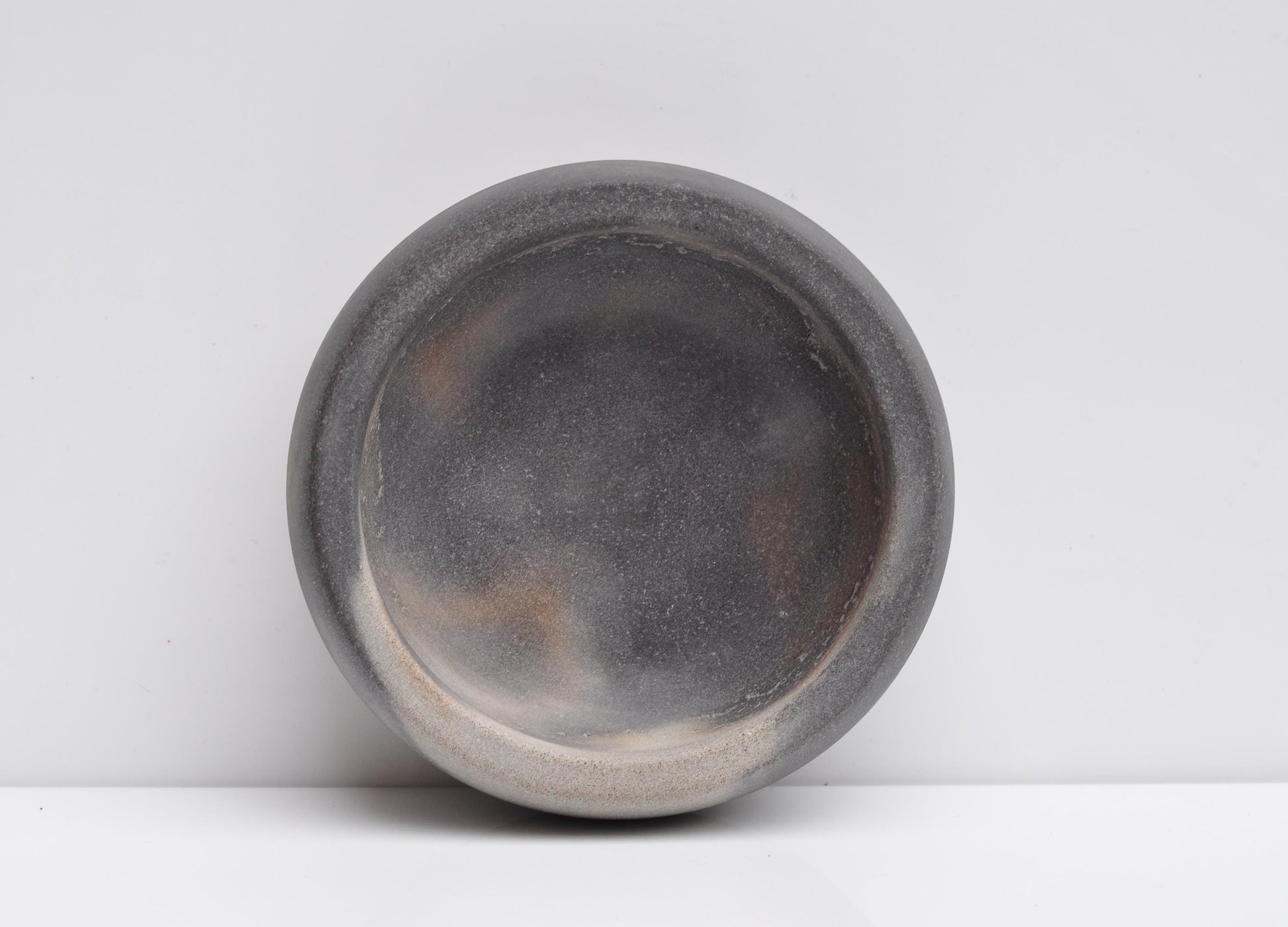 Close-up texture of handmade grey concrete bowl
