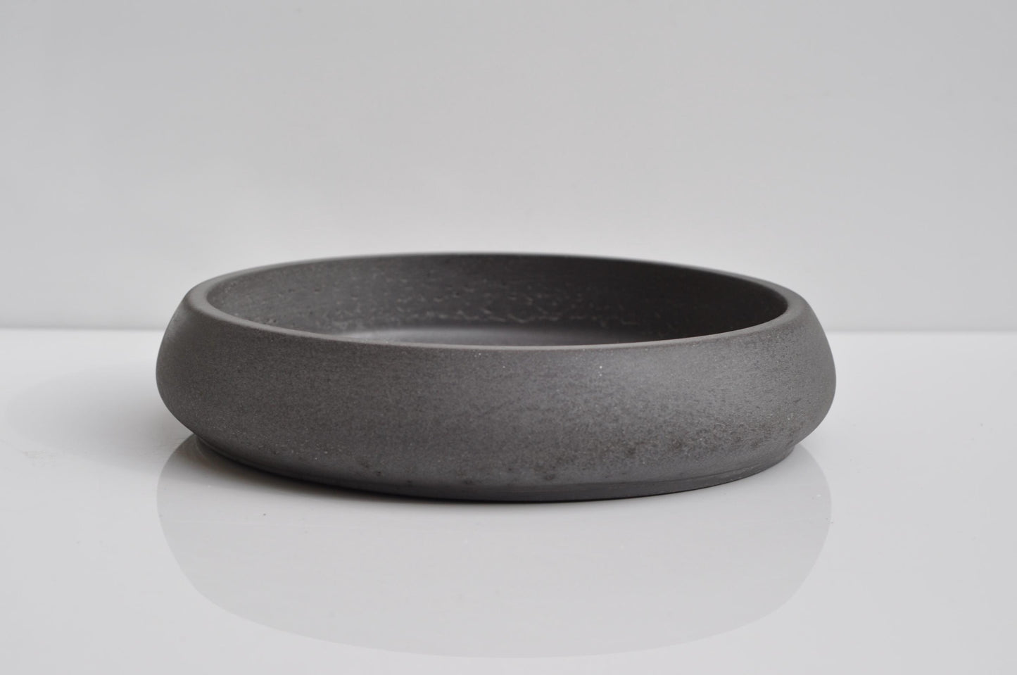 Side angle of sleek handmade anthracite bowl