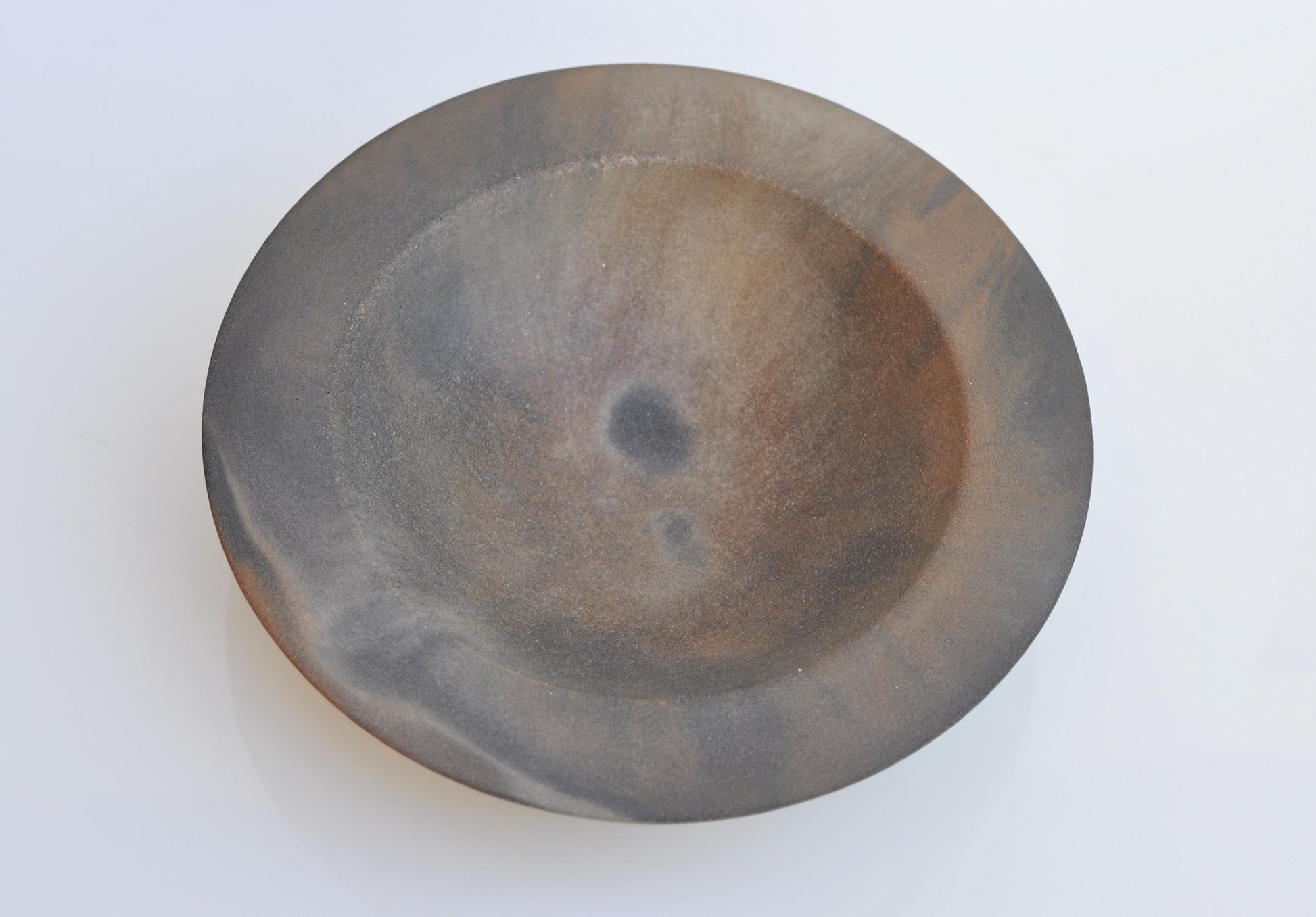 Decorative grey and orange concrete bowl for small items