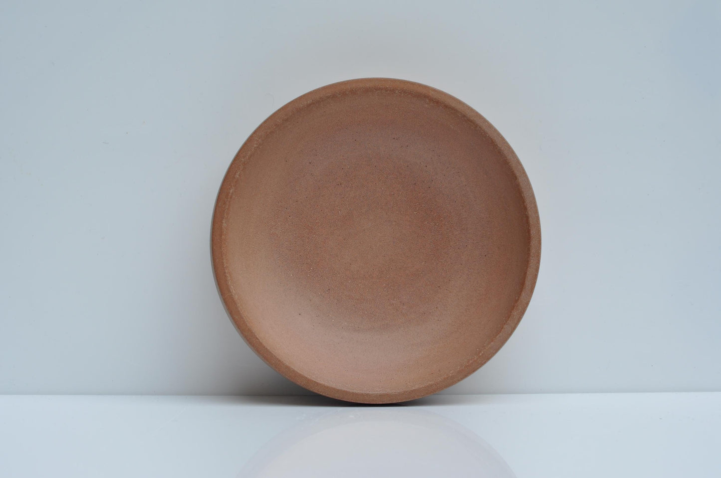 Modern concrete bowl against plain background