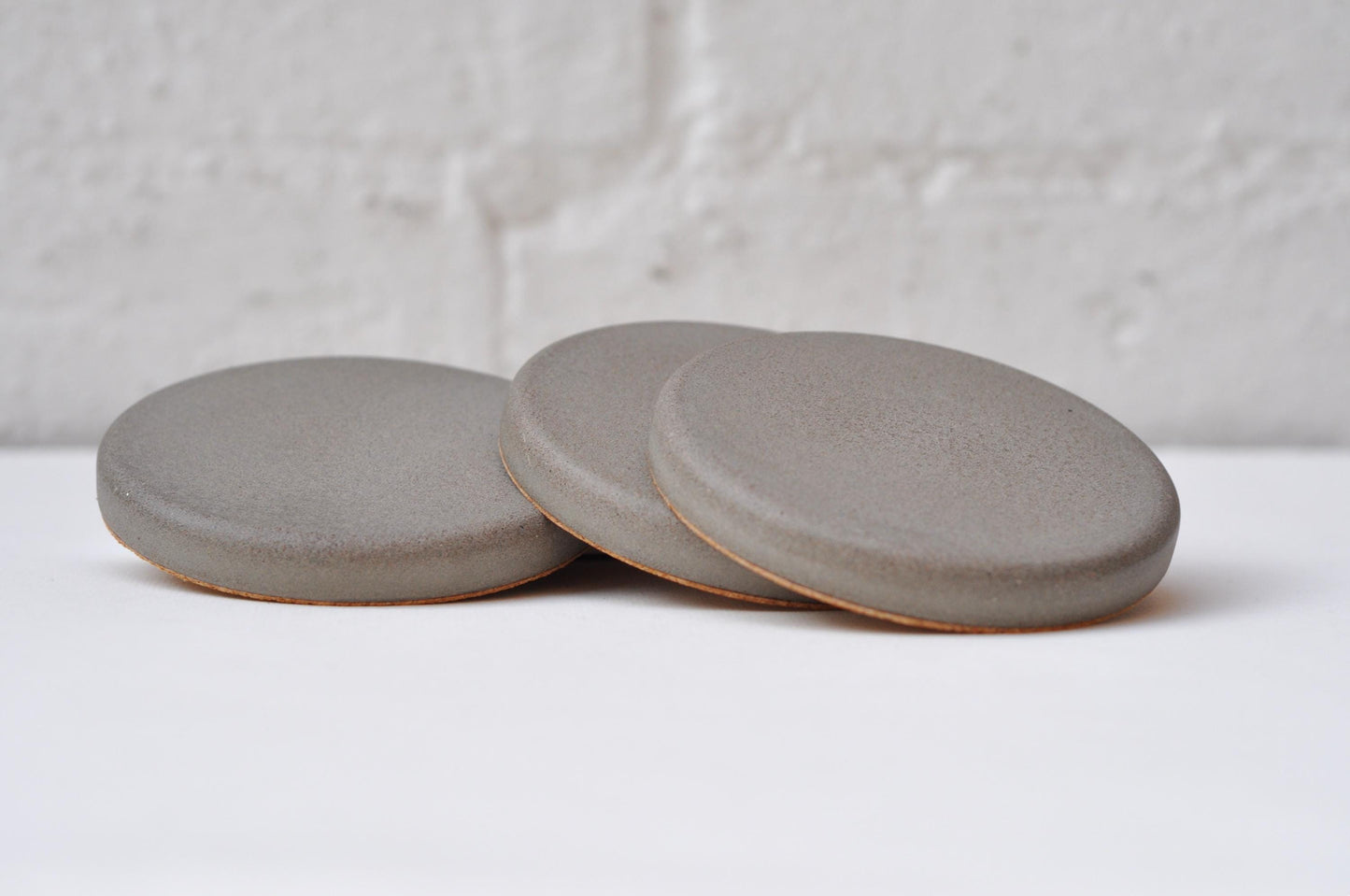 Modern concrete coasters stacked together