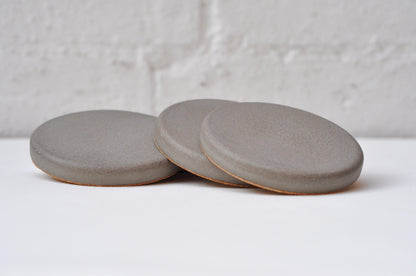 Modern concrete coasters stacked together