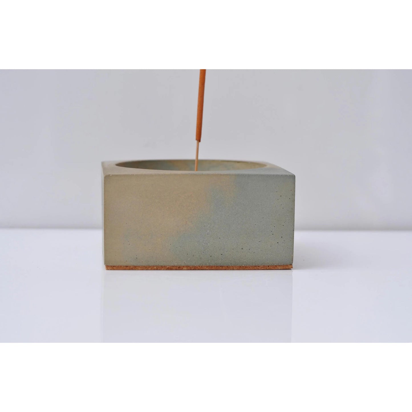 Modern brutalist incense holder styled on shelf