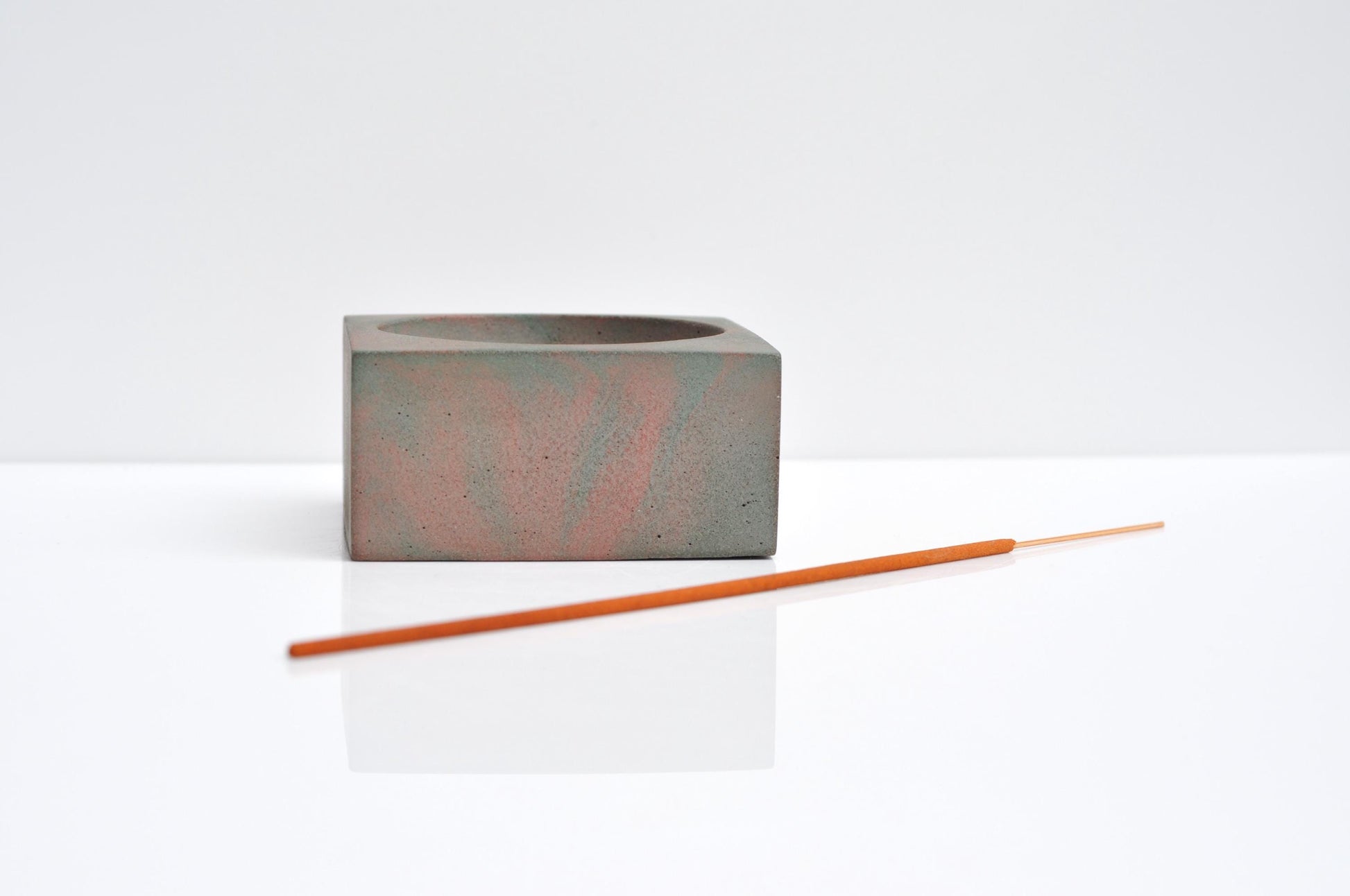 Studio shot of handmade concrete incense burner