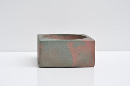 Concrete incense burner on wooden table