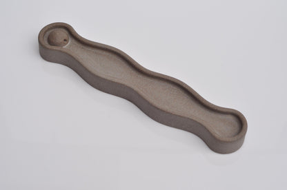 Side angle of modern concrete incense tray