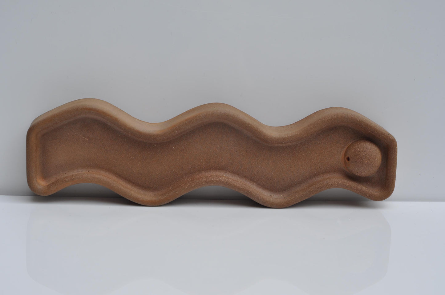 minimalist orange cement incense holder