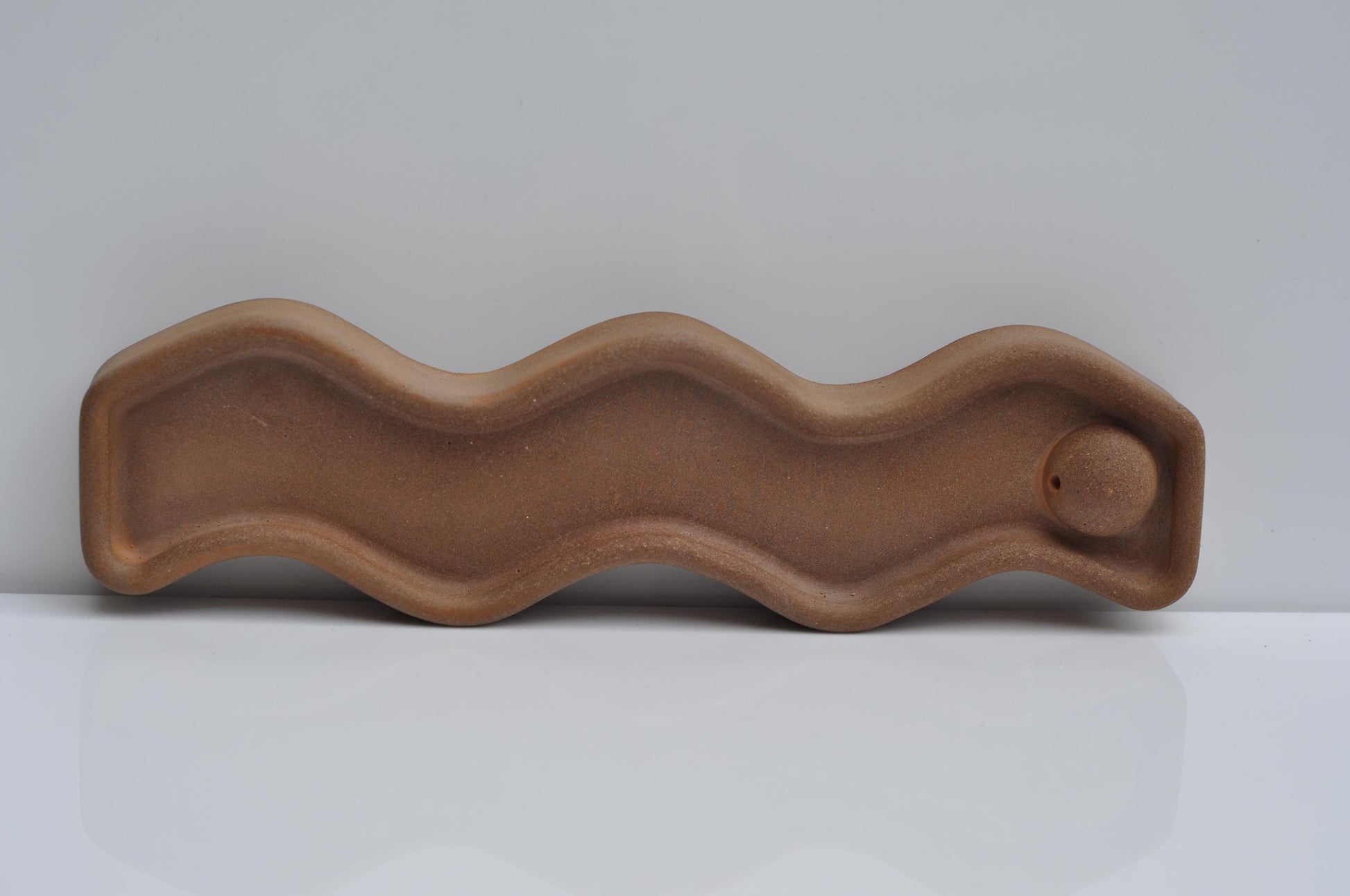 minimalist orange cement incense holder