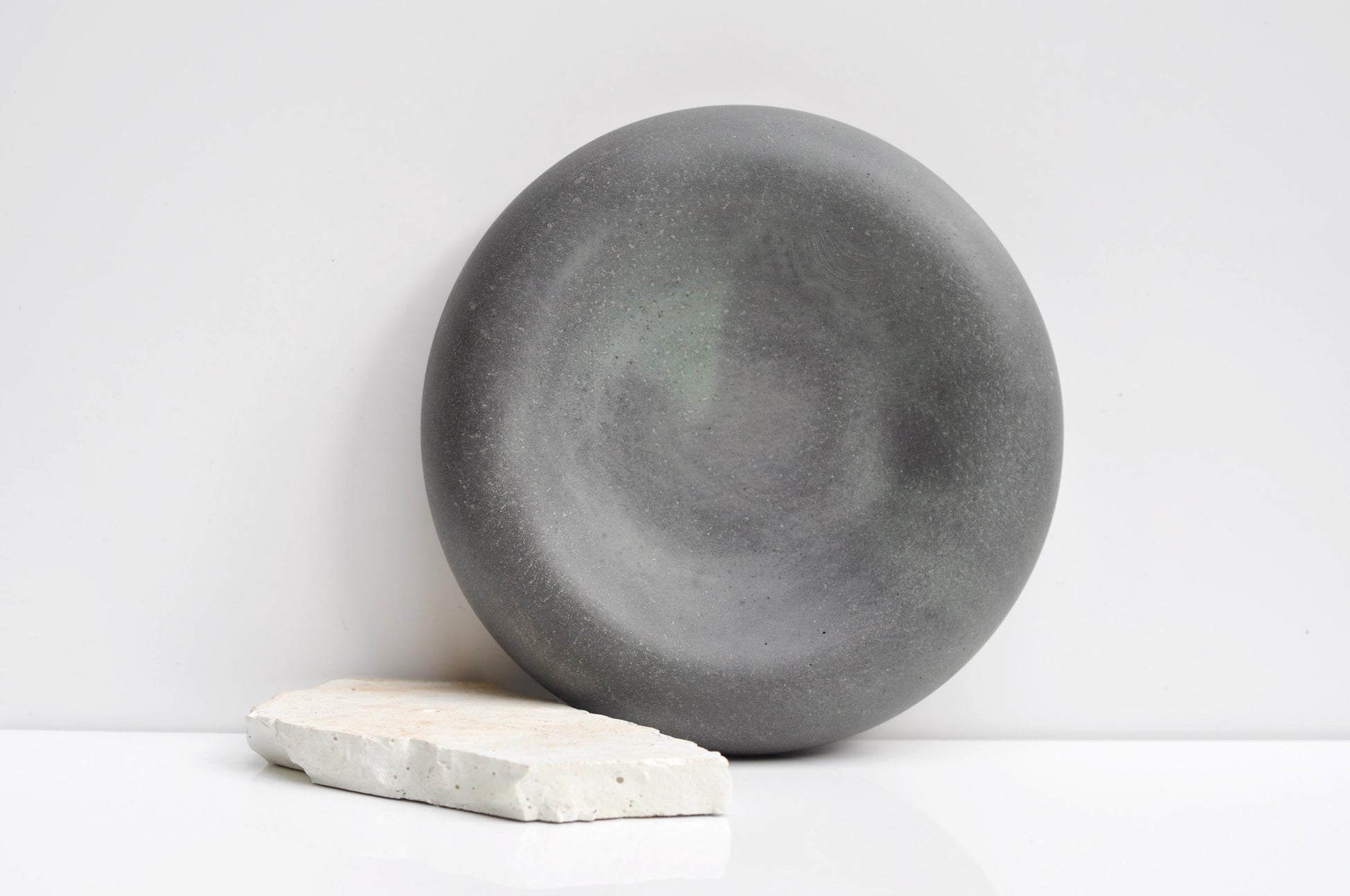Handmade modern concrete dish styled on table