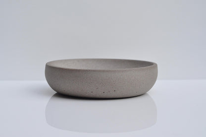 Side angle of small concrete dish for keys and coins