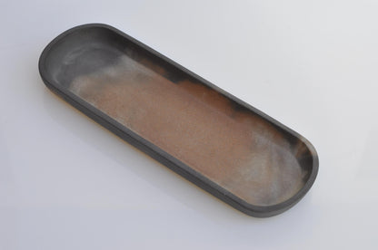 Grey and terracotta cement tray used for cosmetics or jewellery