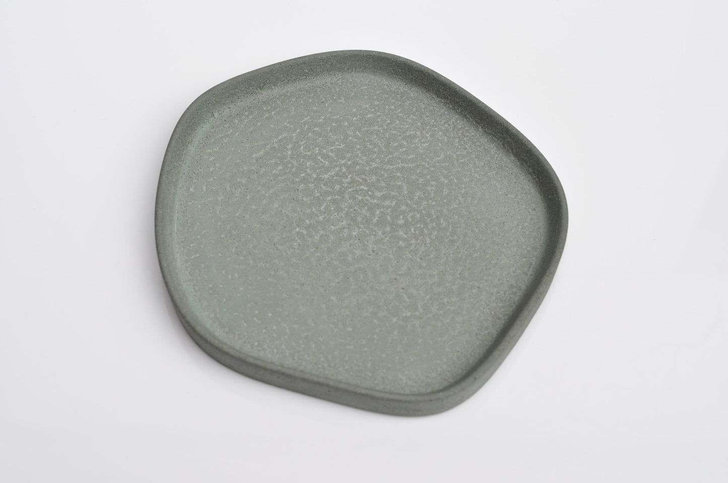 Textured handmade concrete plate with unique shape