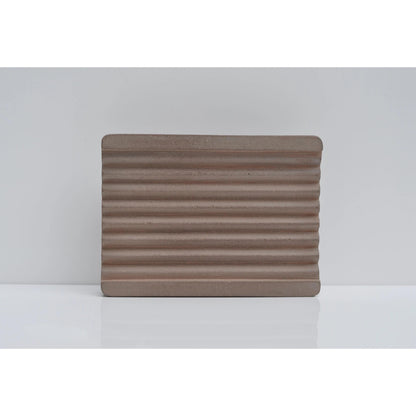 Brown cement soap tray on countertop