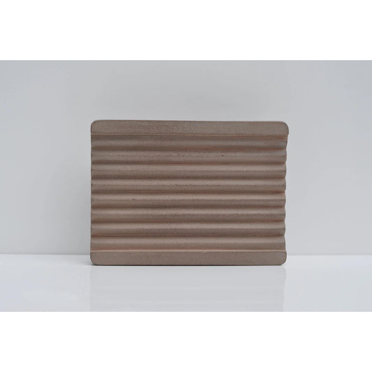 Brown cement soap tray on countertop