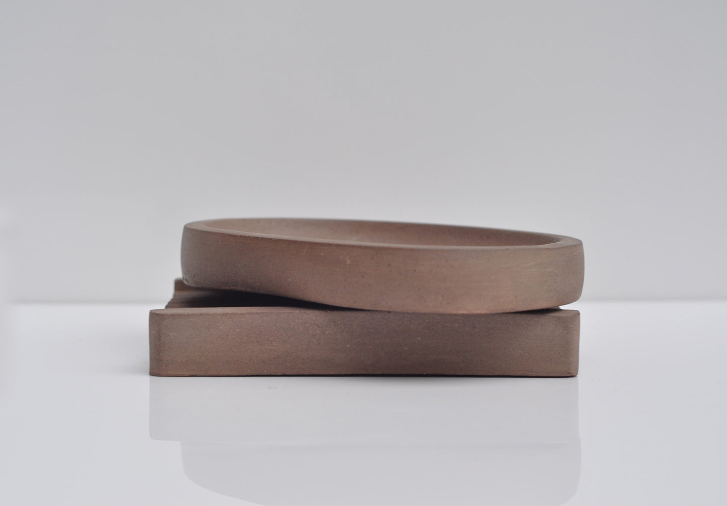 Textured concrete soap dish surface close-up