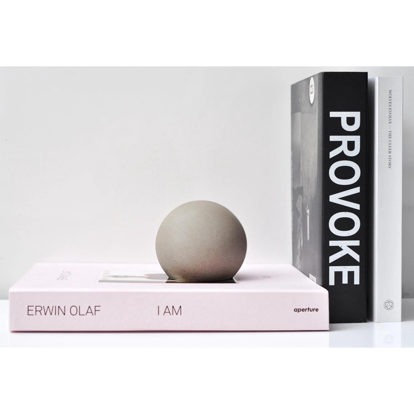 Handmade concrete sphere ornament on neutral background