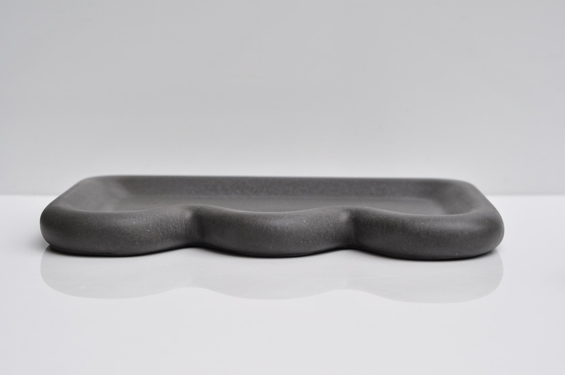 Concrete tray for keys or jewellery in modern home