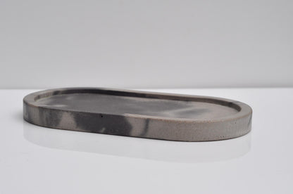 Decorative oval concrete tray on shelf