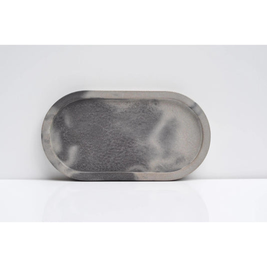 Side view of handmade oval concrete tray