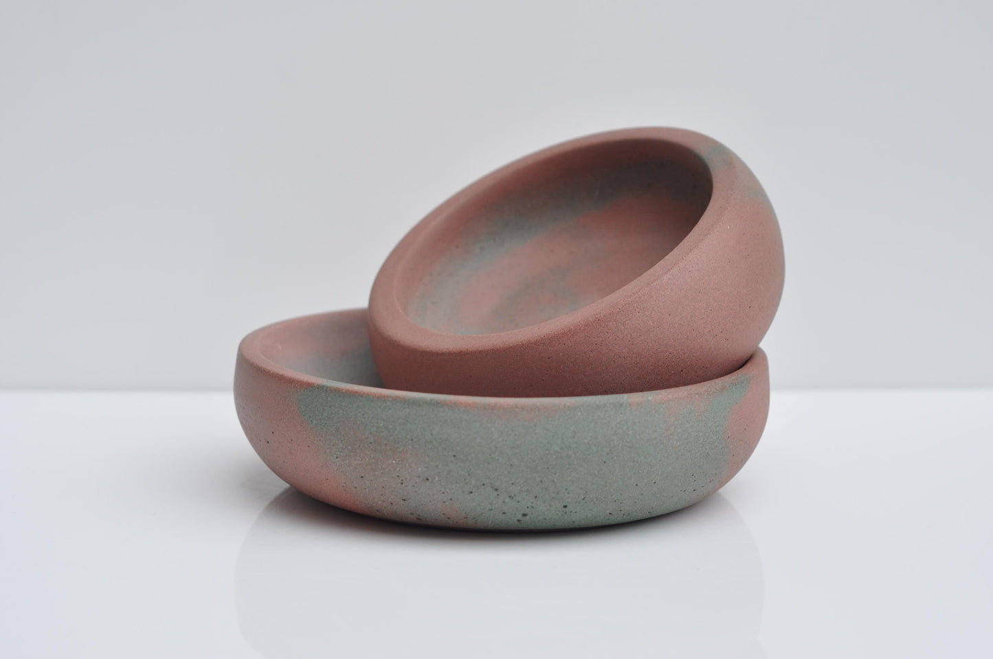 Minimalist concrete trinket dish styled on shelf