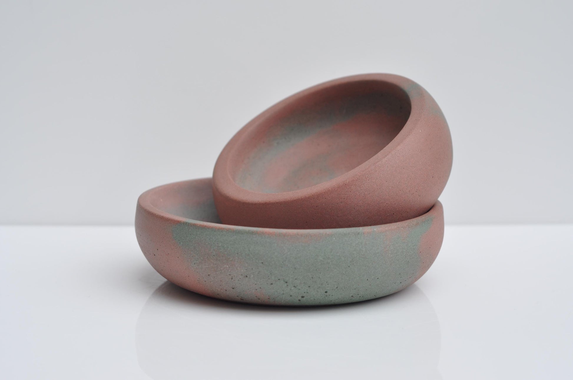 Minimalist concrete trinket dish styled on shelf