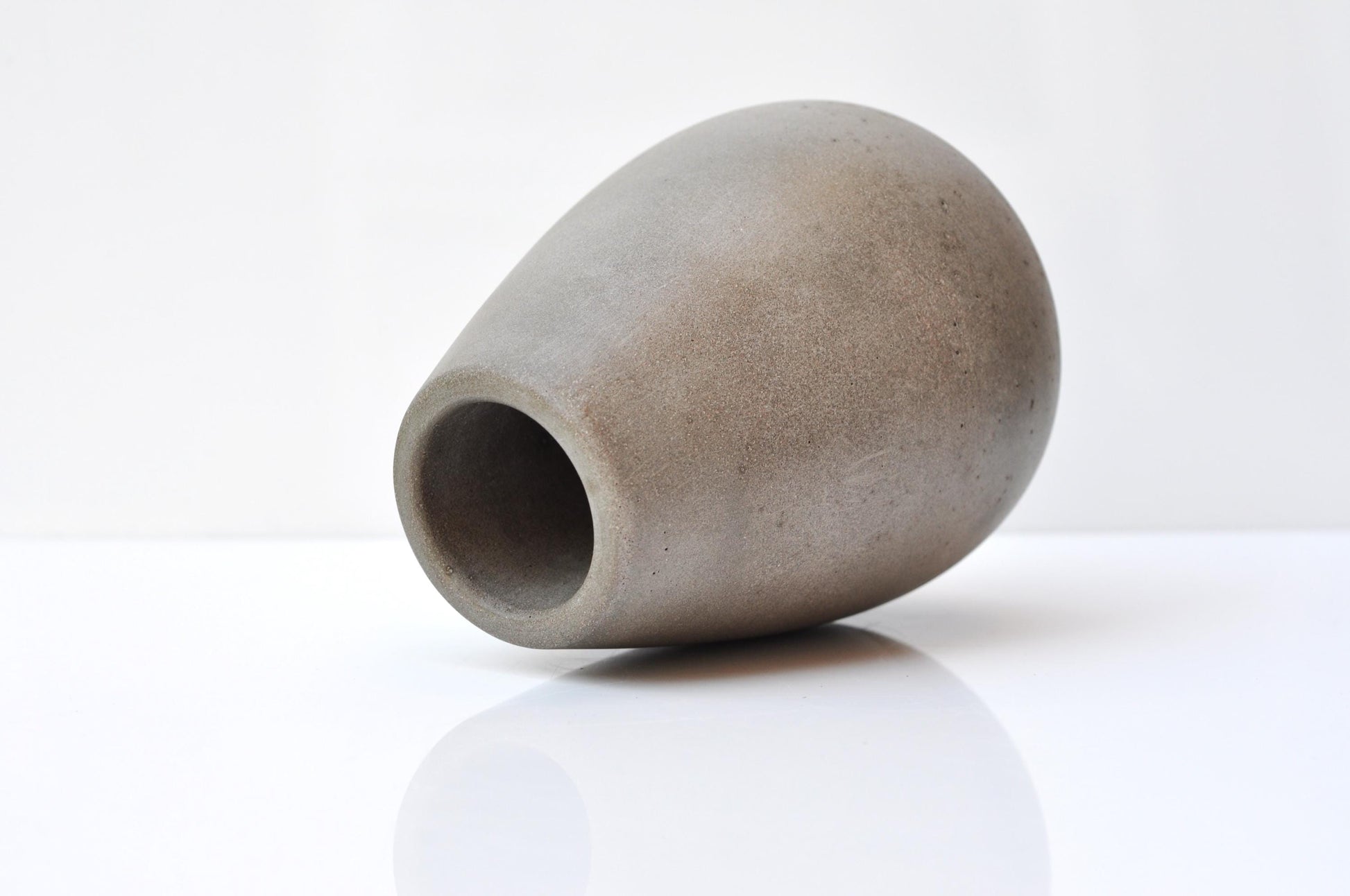 Handmade cement vase side angle