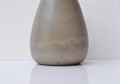 Sleek grey concrete vase isolated on background