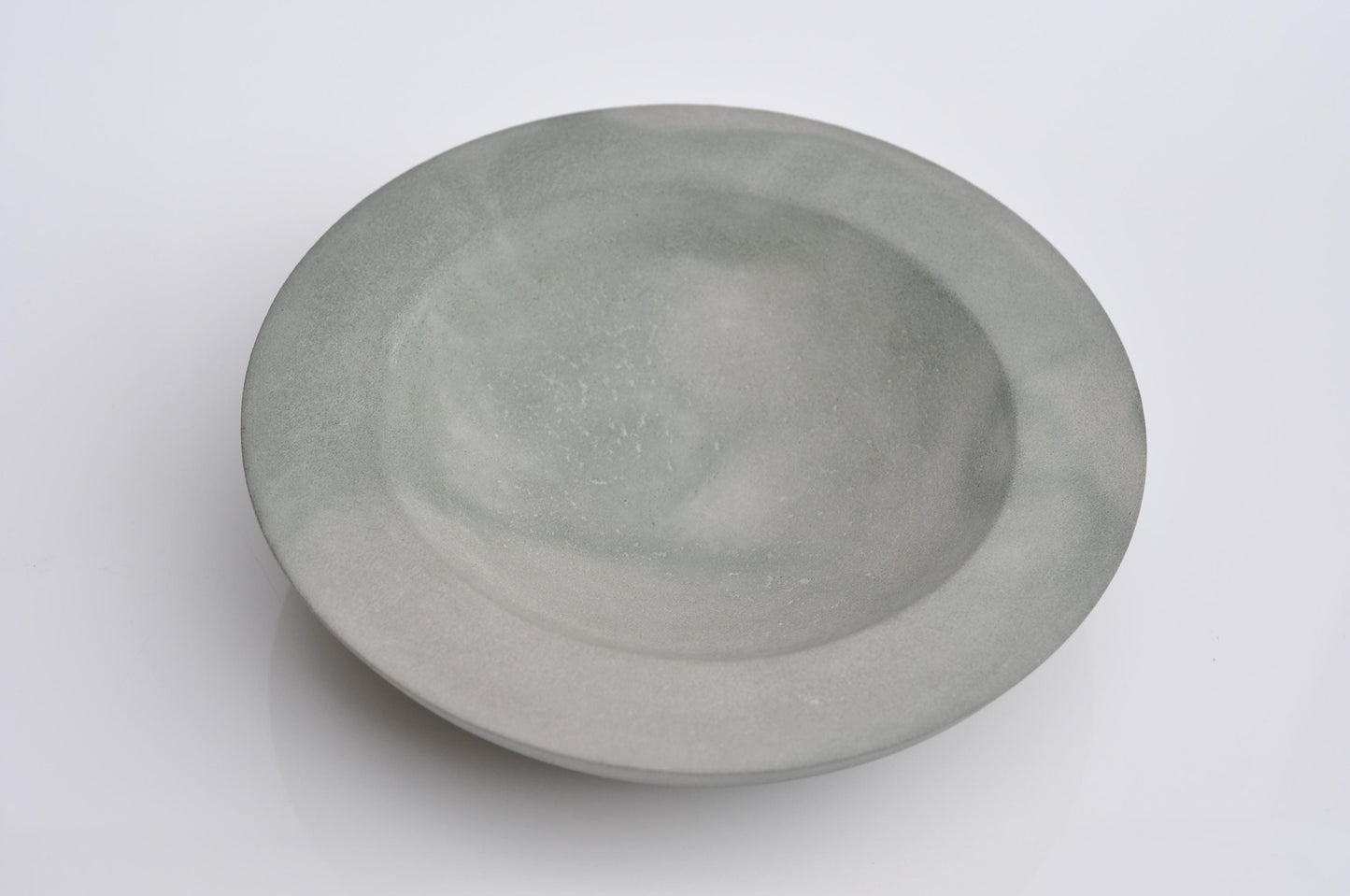 Handmade irregular concrete dish in green-grey tones