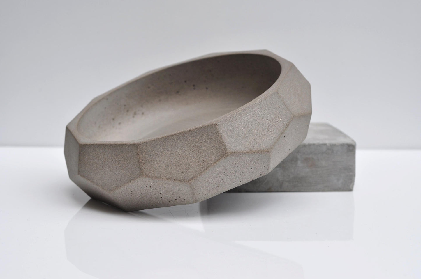 Minimalist diamond concrete bowl styled on shelf