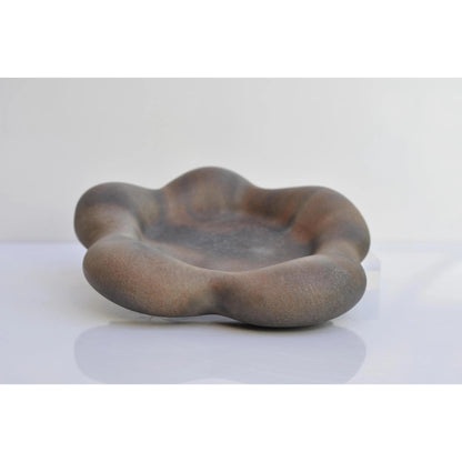 Handmade flower-shaped concrete tray used as key holder