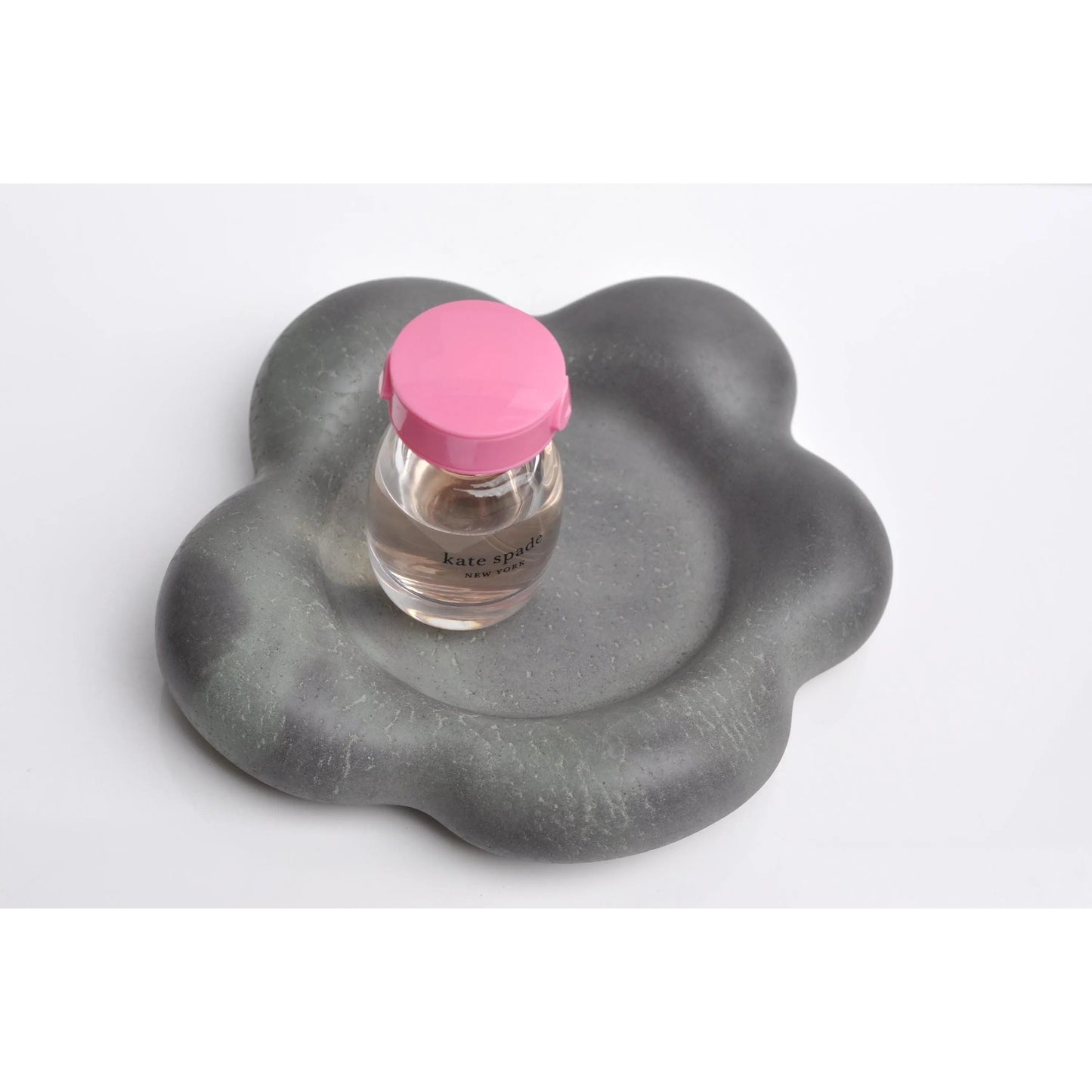 Handmade flower-shaped concrete tray used as key holder