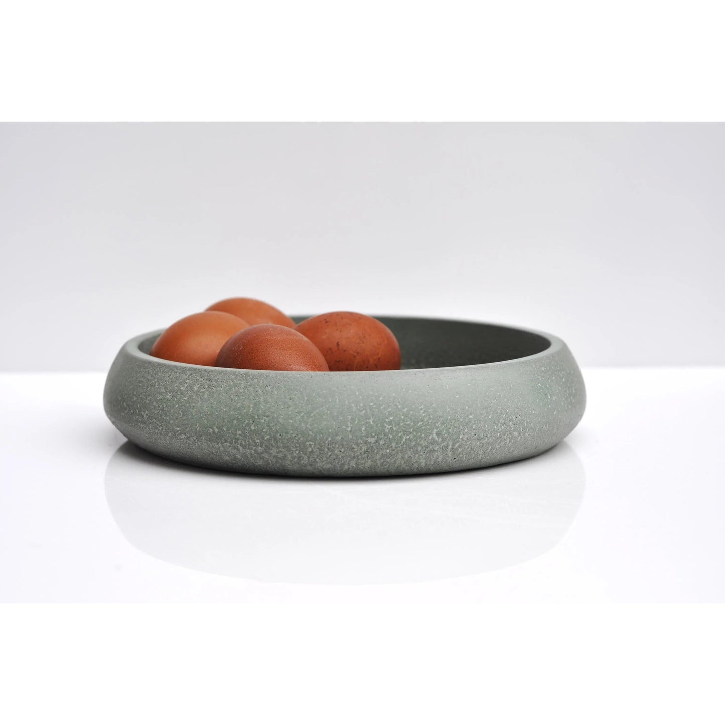 Handmade green concrete bowl for modern home décor