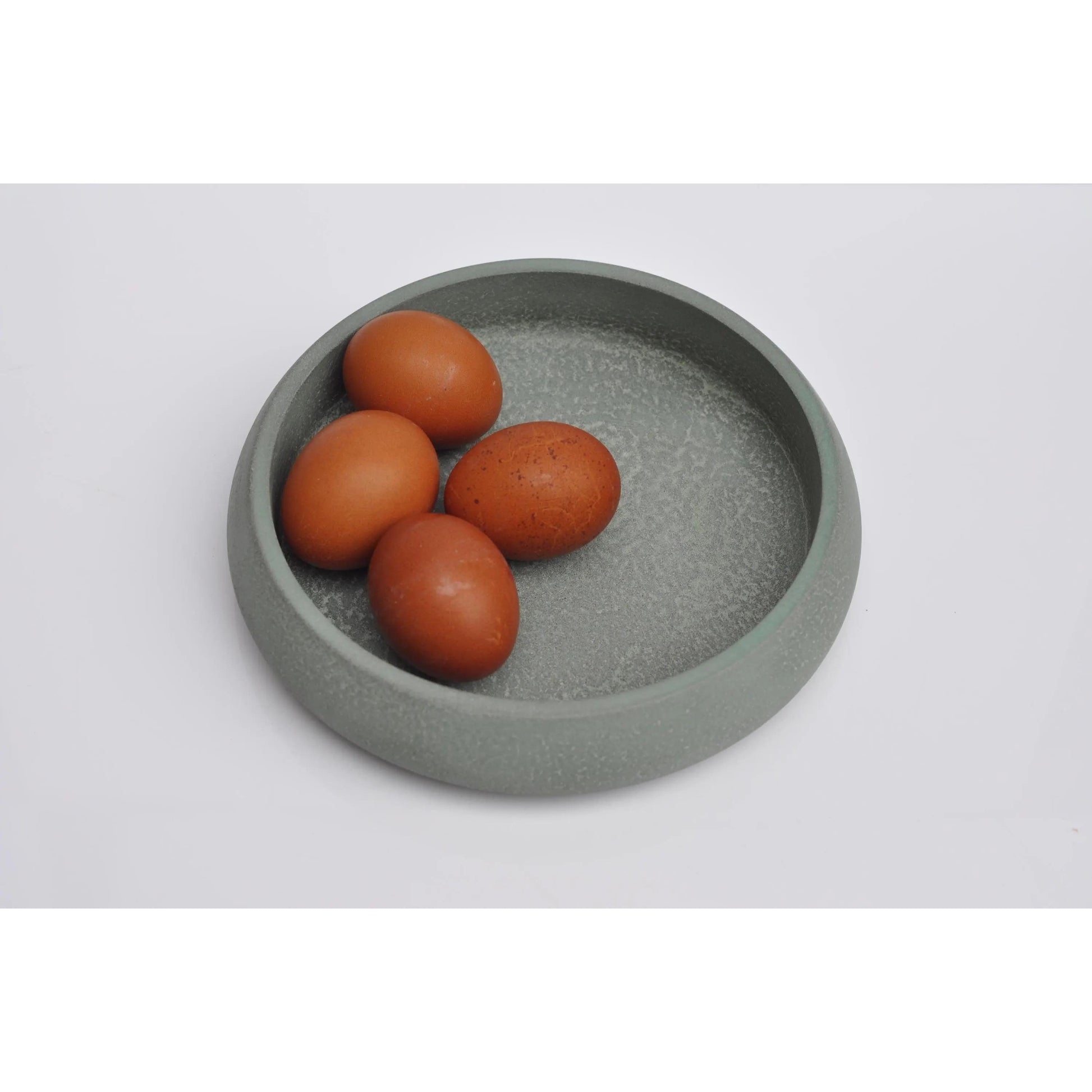 Concrete bowl holding keys and accessories