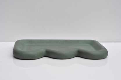 Side angle of handmade green cement tray