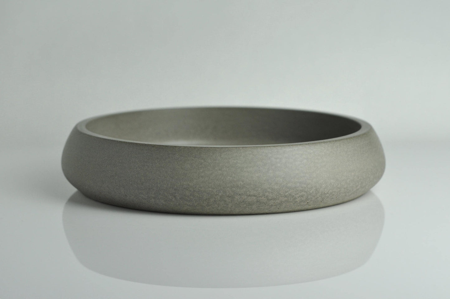 Side angle of modern grey concrete bowl