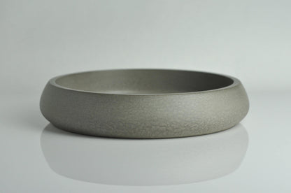 Side angle of modern grey concrete bowl