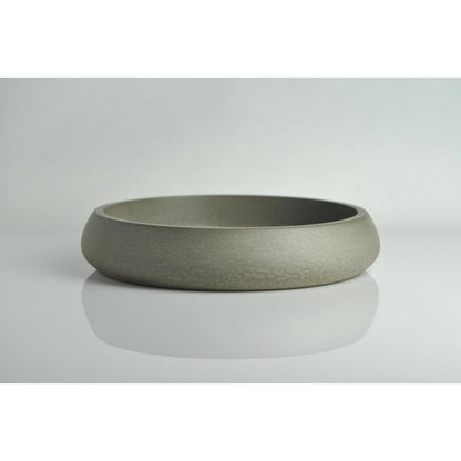 Grey concrete key bowl on entryway table
