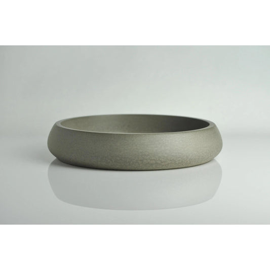 Grey concrete key bowl on entryway table