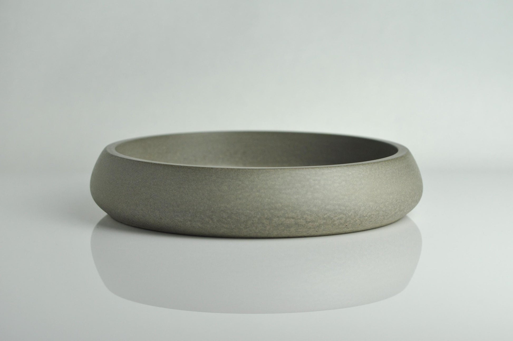 Studio shot of grey handmade concrete bowl