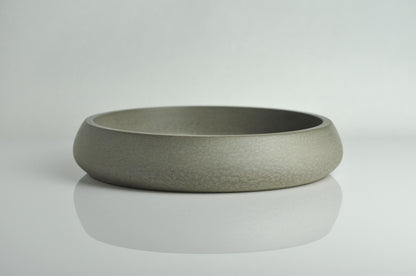 Studio shot of grey handmade concrete bowl