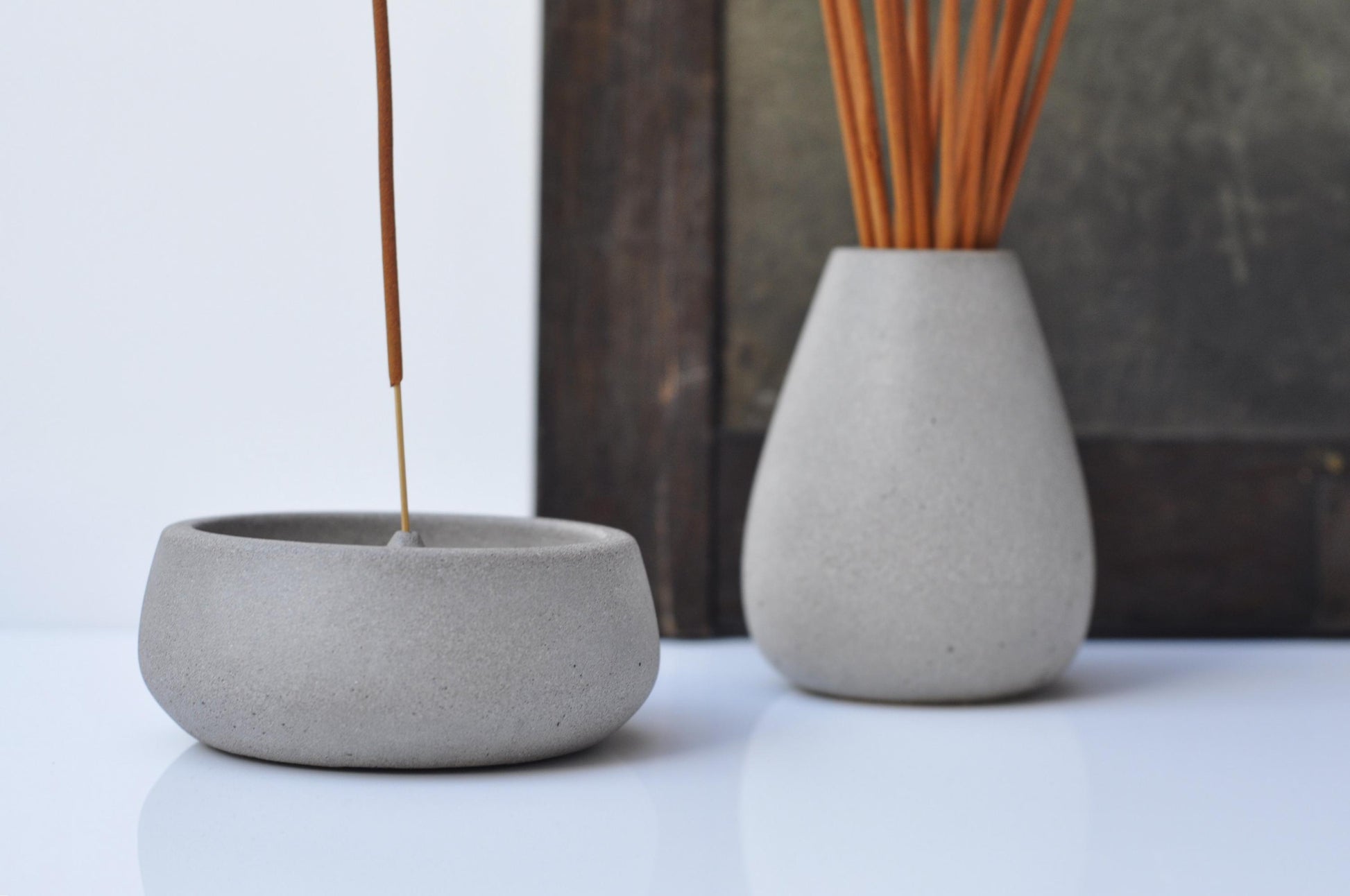 Detail of grey cement incense holder
